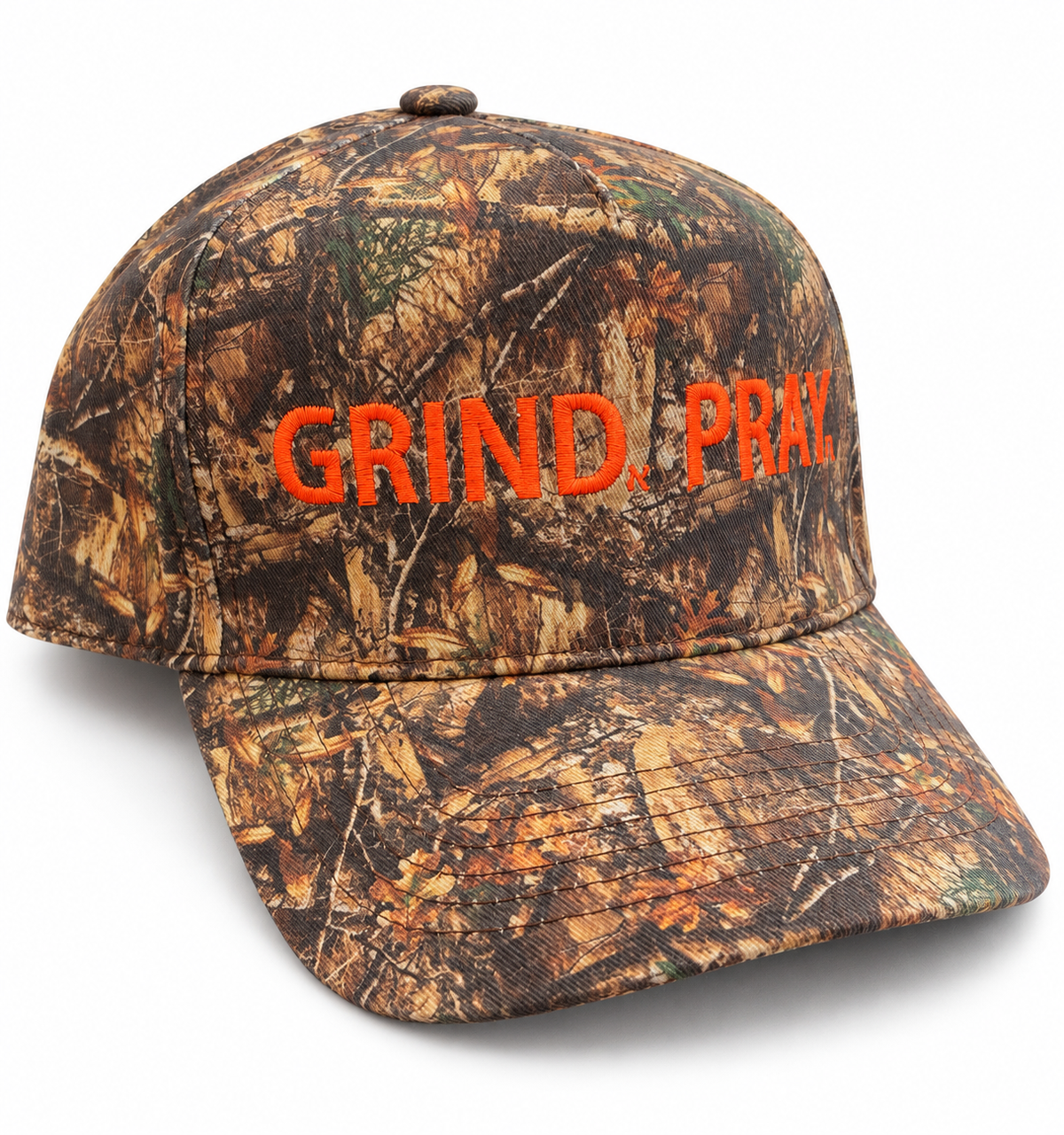 Woodland camouflage cap with orange Grind.Pray. embroidery and a curved brim