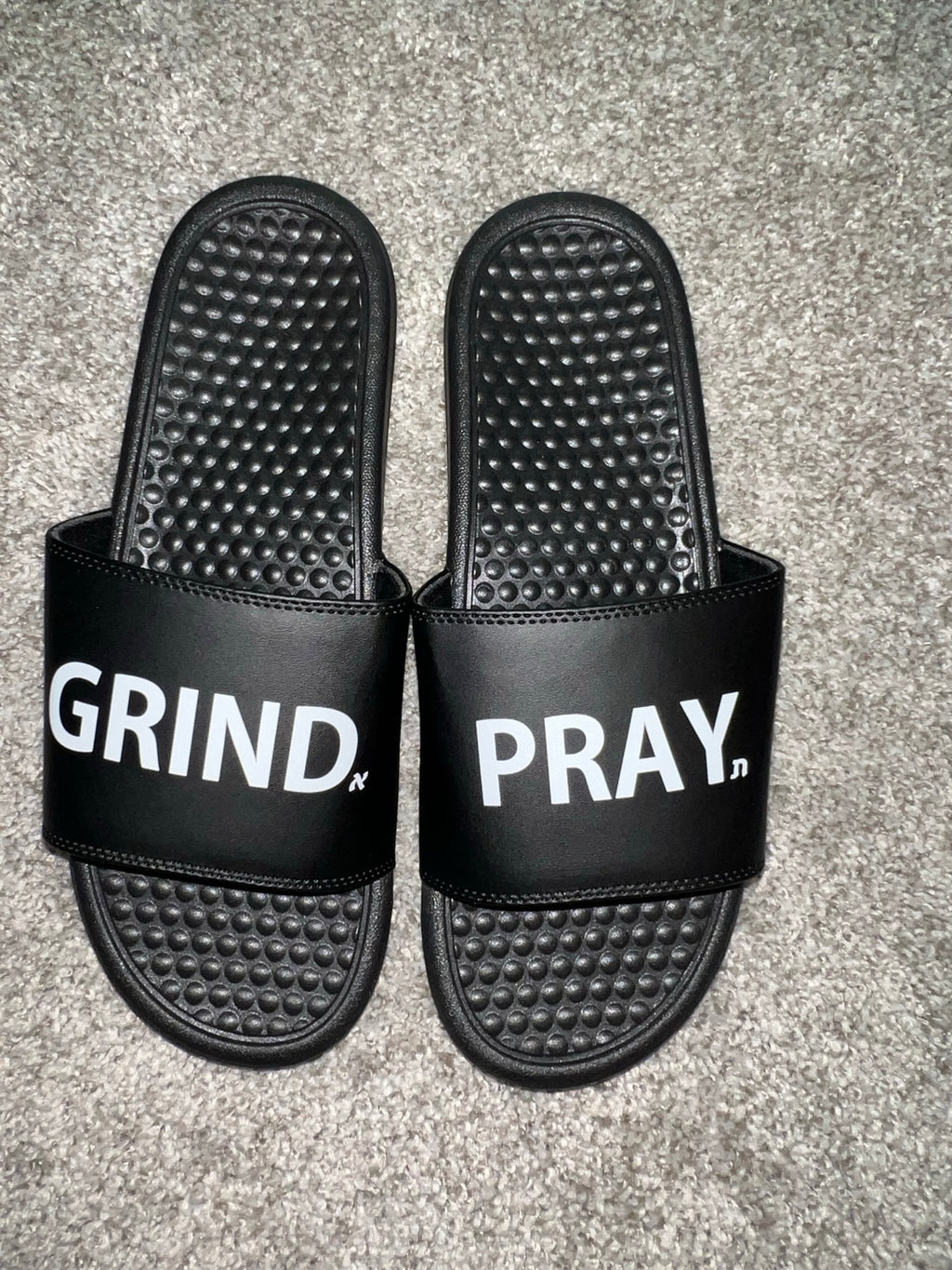 Grind.Pray. slides real-life product photo