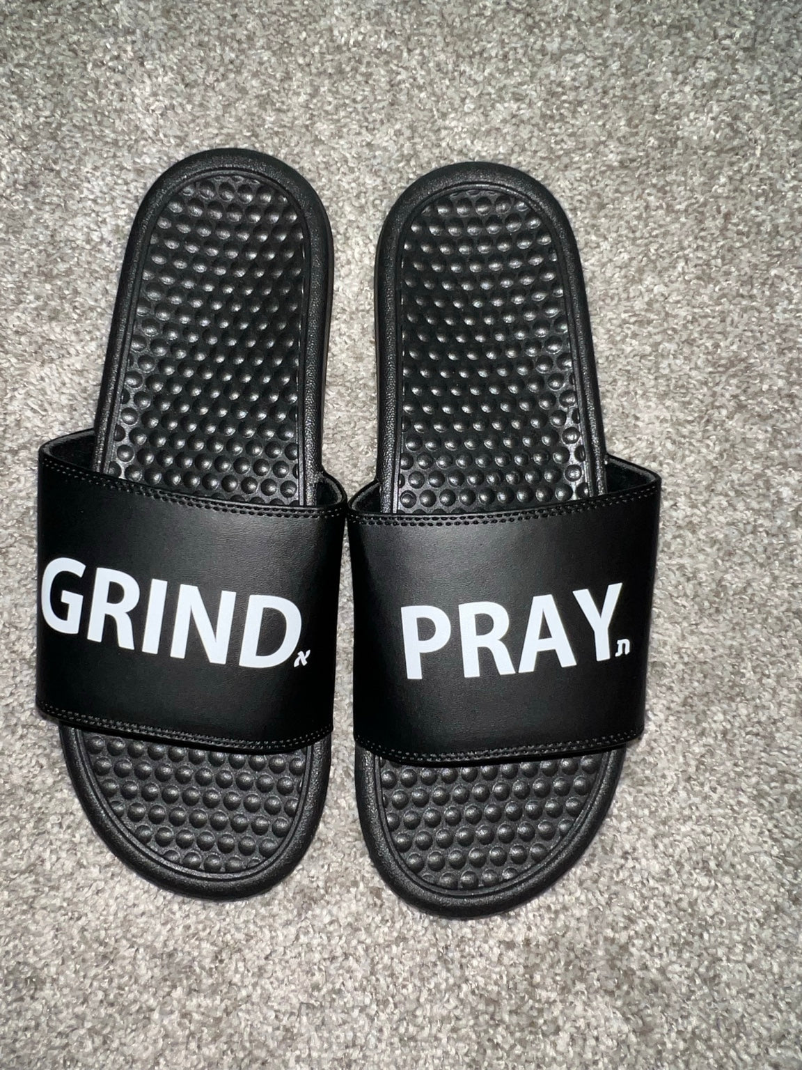 Grind.Pray. slides real-life product photo